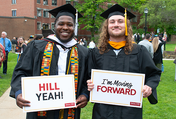 students celebrating graduation