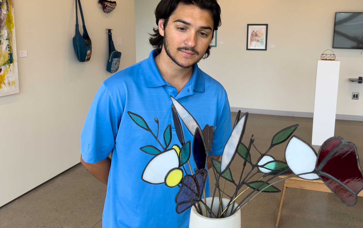 Student Viewing Art in Gallery