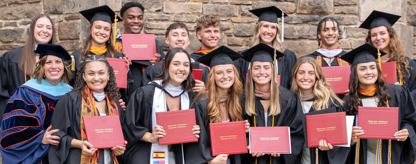 Seton Hill Grads Showing Off Diplomas