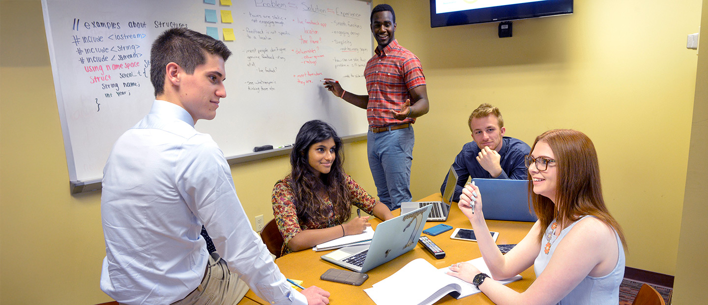A group of students studying around a table