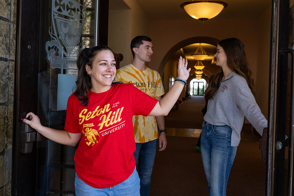 A group of students exiting the Administration Building