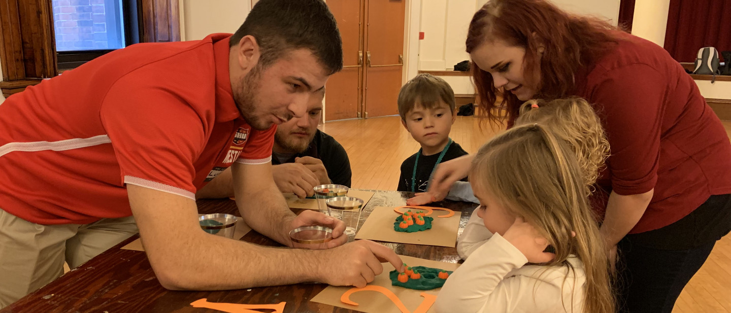 Seton Hill Students teaching grade schoolers how to count.