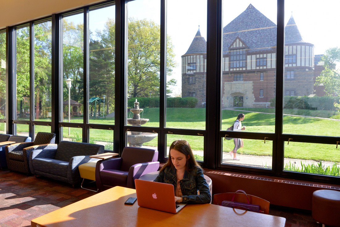 A female student working in the student lounge