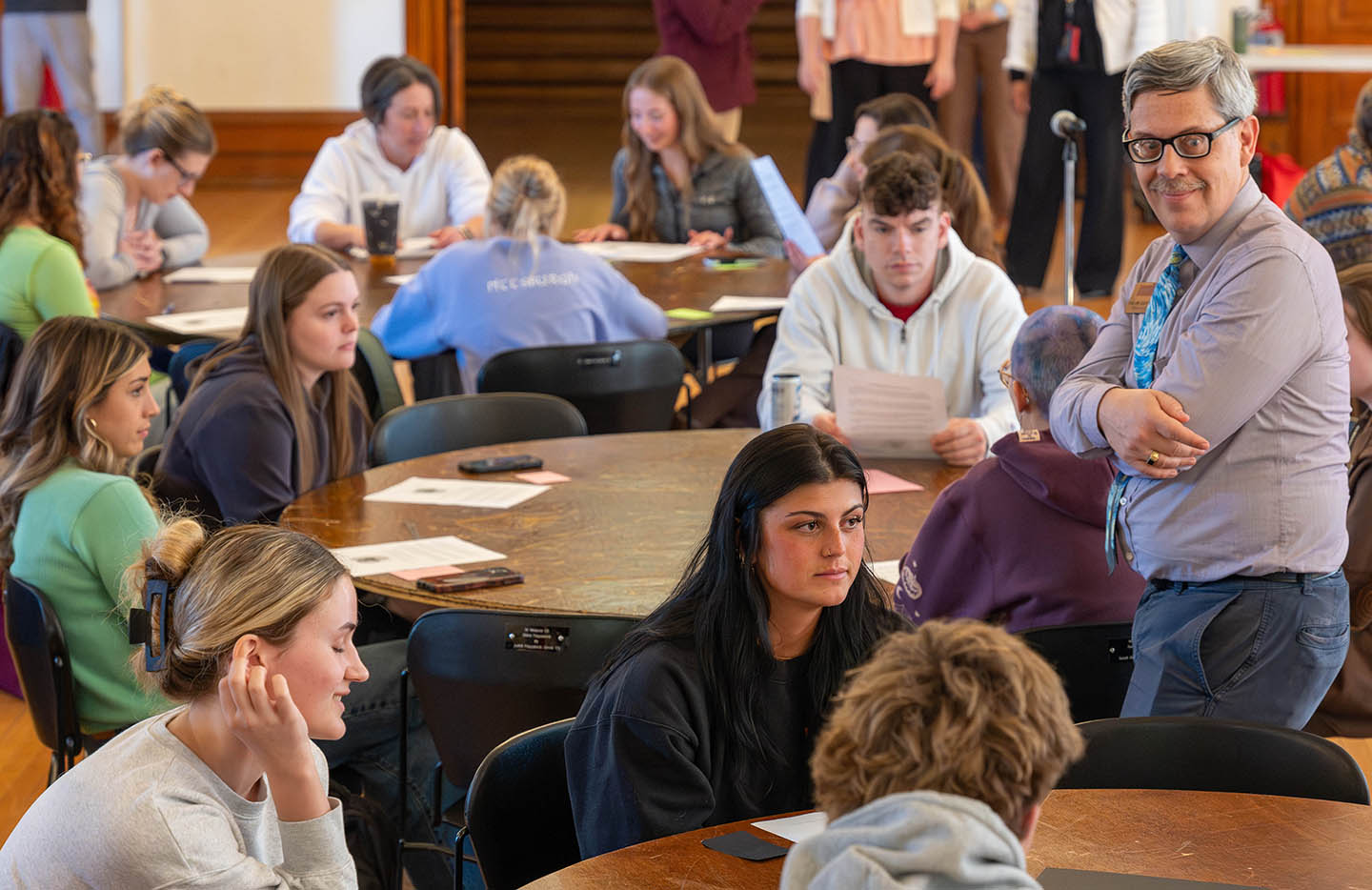 dean of the school of humanities David von Schlichten observes students at the AI Ethics bowl