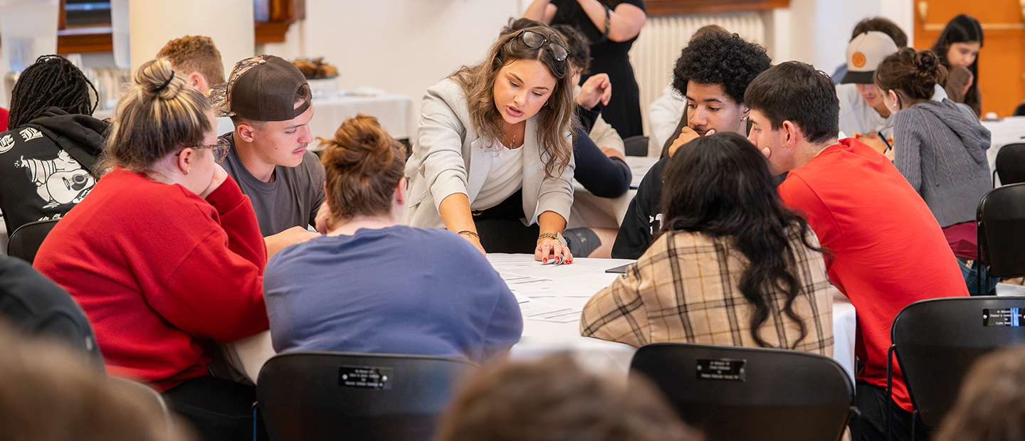 A KPMG representative works with Seton Hill University students on a case study presented in the workshop.