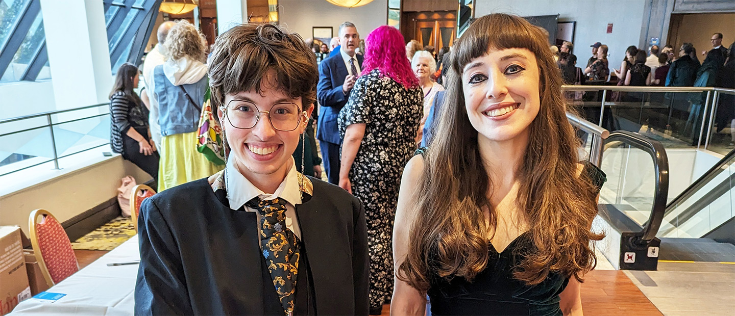 Two people posing for a picture.