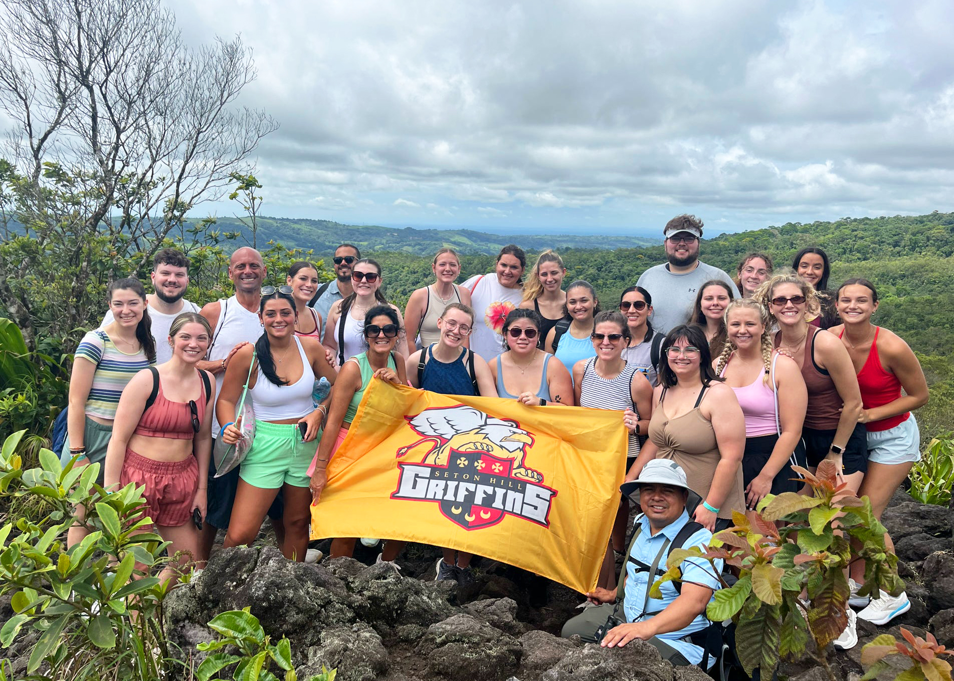 Group of people at a jungle overlook.