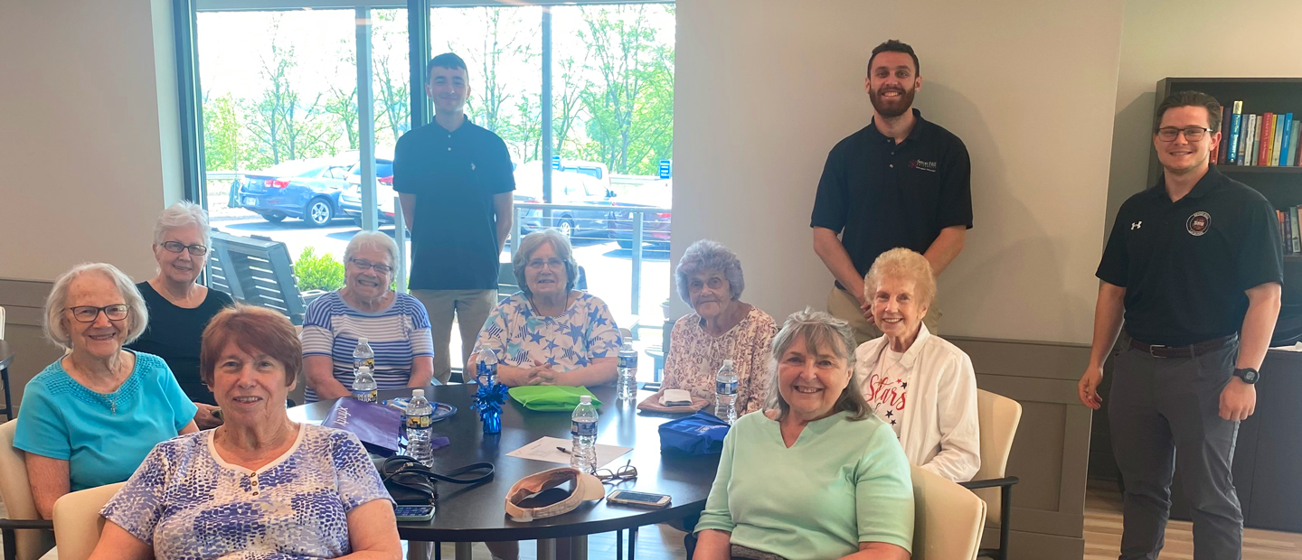 Cybersecurity staff with Senior Apartments residents.